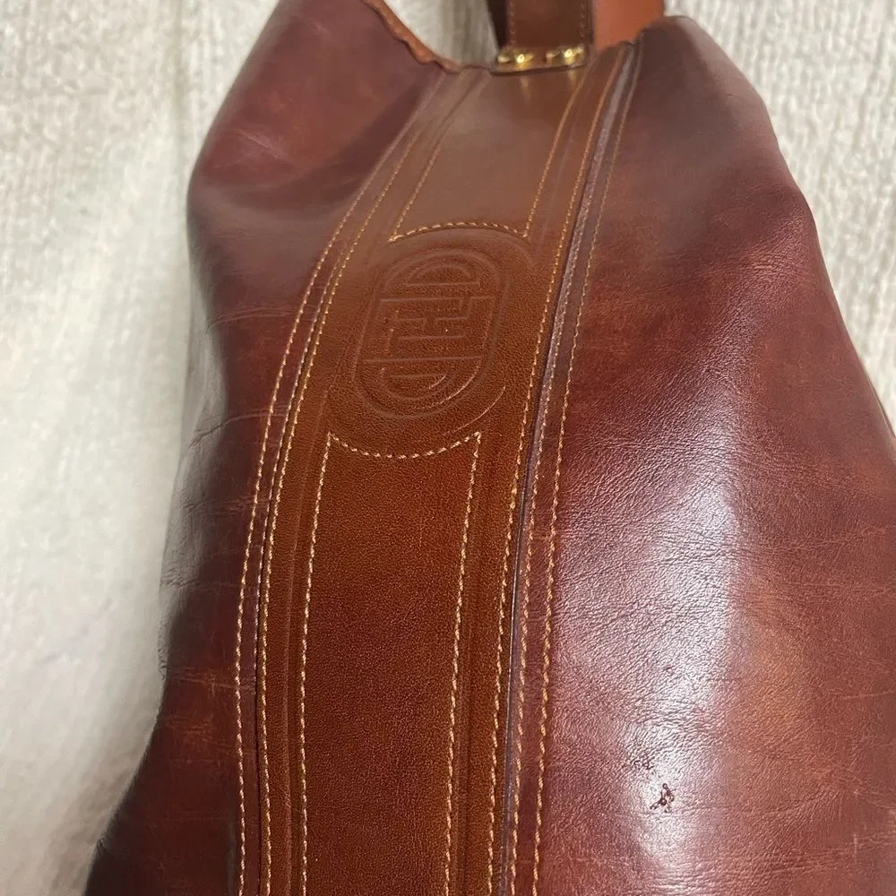 Fortune Duck vintage leather Brown sling back bucket style  bag.